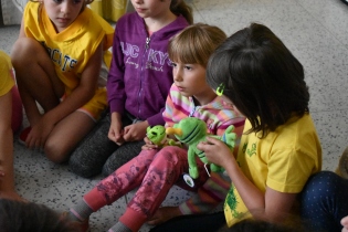 On Friday, the children took turns holding Signal and Sparky while Amy read them a story about frogs.